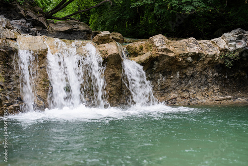 Beautiful tropical waterfall on rainy day
