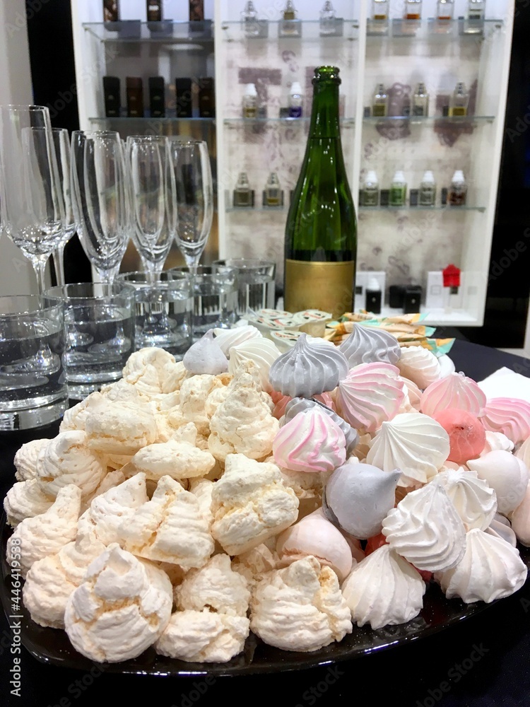 meringue cakes and champagne in a glass 
