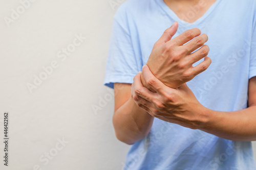 a man support his arms which pain,numbness,weakness,paralysis concept of Guillain barre syndrome caused by autoimmune disorder