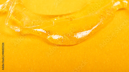 piace golden dab concentrate of cannabis wax close up on yellow background, marijuana resin photo