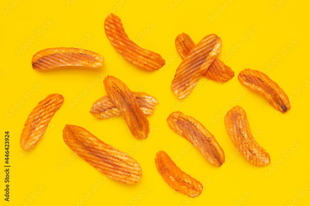 Spicy snack, Banana slice chips paprika flavor on yellow background. Spicy snack, Banana slice chips paprika flavor on yellow background.