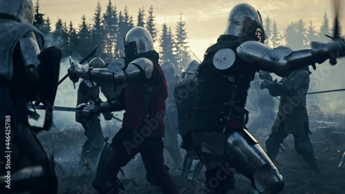 Epic Battlefield: Armies of Medieval Knights Fighting with Swords. Dark Ages Warfare. Action Battle of Armored Warrior Soldiers, Killing Enemies. Blue Cinematic Historical Reenactment. Slow Motion photo