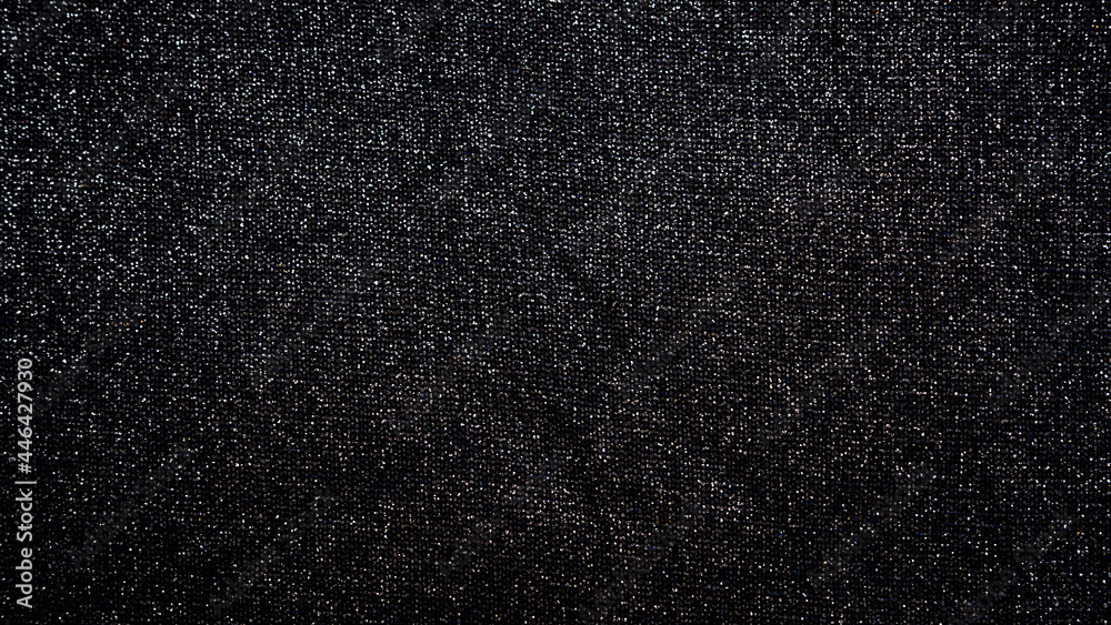Abstract blinking background black fabric. Fabric texture with spangles