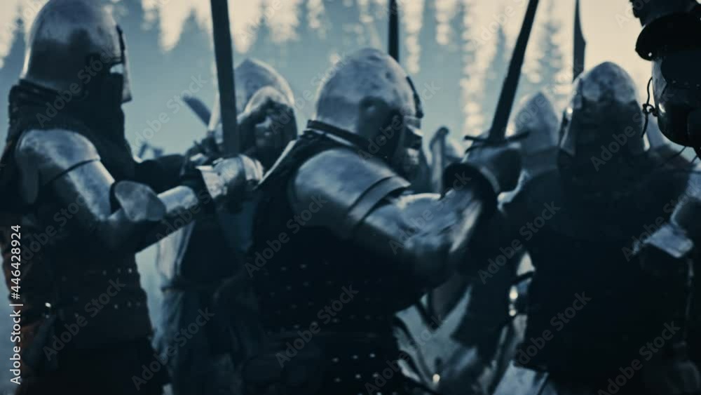 Epic Armies of Medieval Knights on Battlefield Clash, Armored Warriors Fighting Swords. Bloody War, Battle, Invasion. Dramatic Historical Reenactment. Cinematic Blue Light, Slow Motion, Medium