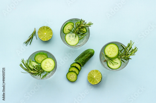 Homemade lemonade with cucumber lemon slices and herbs