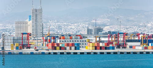 Container yard with straddle carriers and other facilities in cargo terminal of Limassol port, Cyprus photo