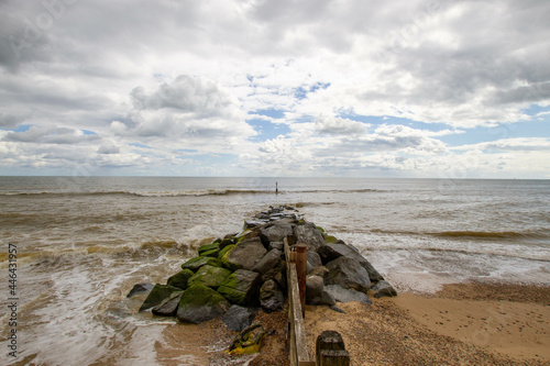 Beautiful view of Calshot Beach under a cloudy sky in Southampton, UK photo