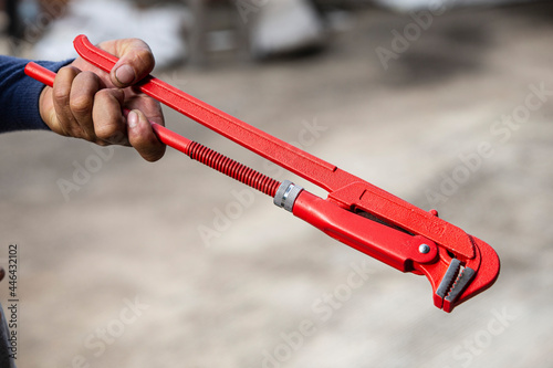hand holding water pump pliers tool