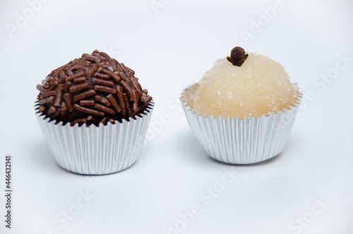 Brigadeiro and Beijinho. Typical Brazilian sweets made with condensed milk, the first with cocoa and the second with coconut. photo
