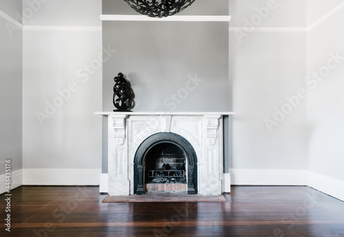 traditional open fireplace with marble surround