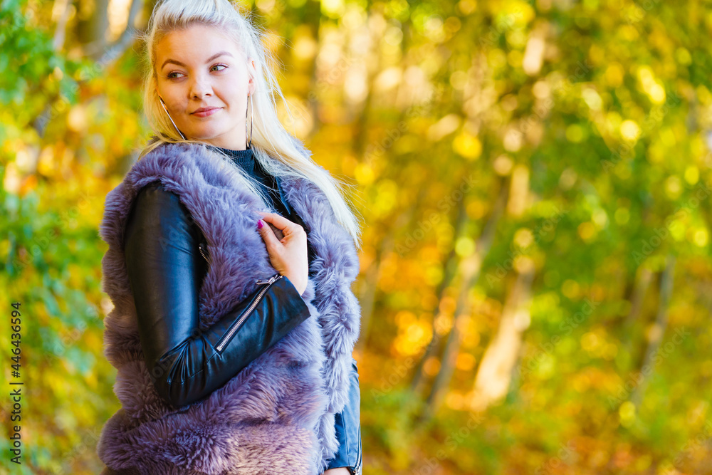 Fashion woman walking in autumn park Fashion woman walking in autumn park