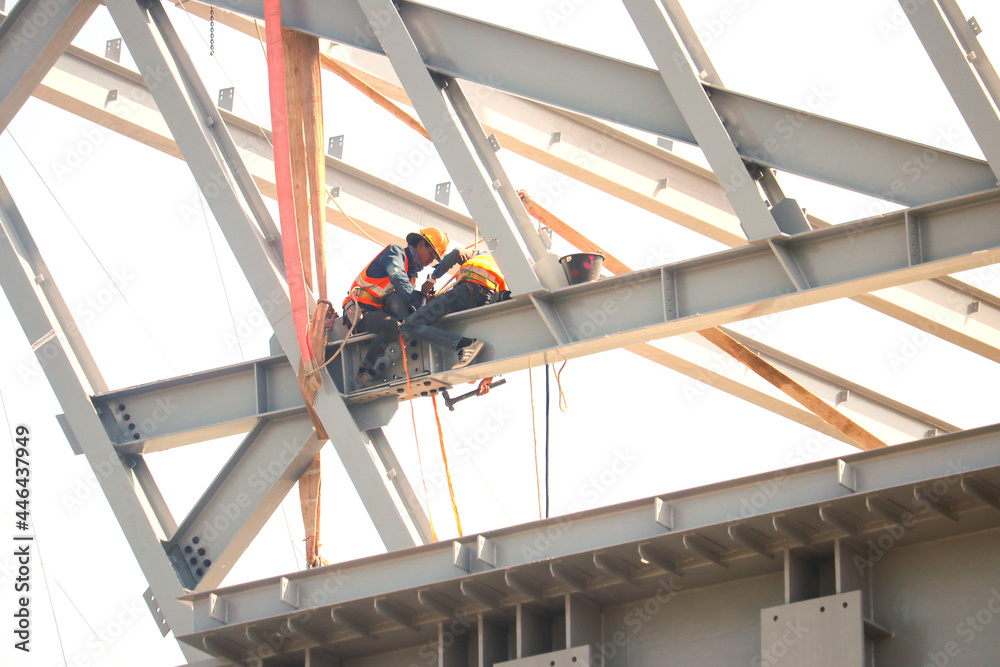 Fototapeta premium Working at Heights Safely, Workers building a train station at Thailand Bangkok.