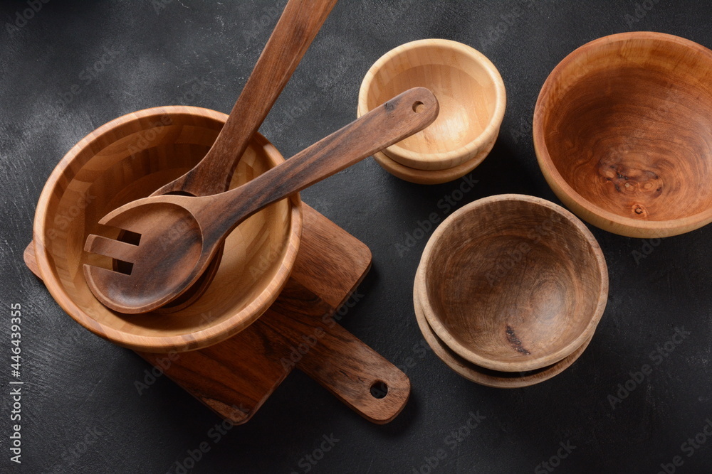 Culinary background, empty ceramic plates, wooden or bamboo spoons and bowls . Rustic style. Home Kitchen Décor. Culinary background, empty ceramic plates, wooden or bamboo spoons and bowls . Rustic style. Home Kitchen Décor.