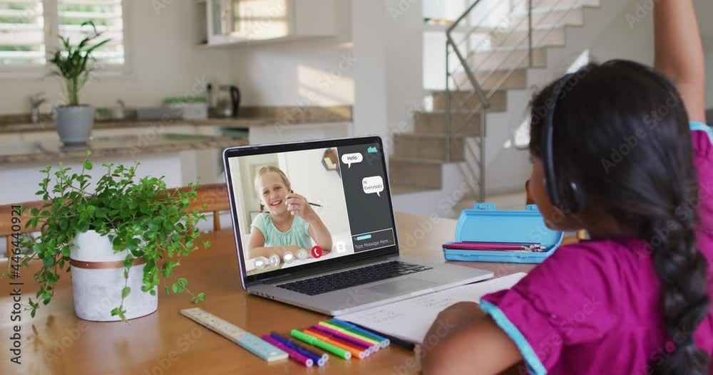Schoolgirl using laptop for online lesson at home, with her colleague and web chat on screen Schoolgirl using laptop for online lesson at home, with her colleague and web chat on screen
