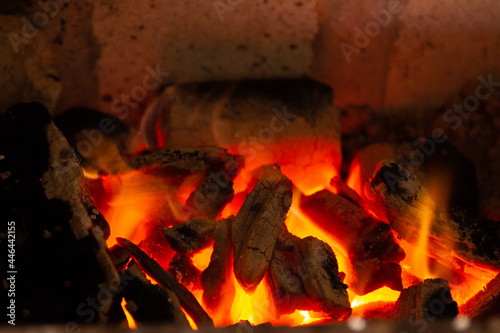 Bruning coal in a barbecue grill photo