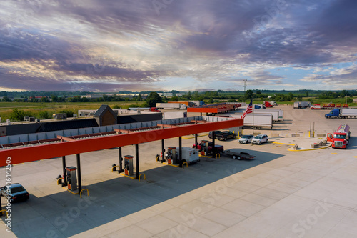 Drone view of the automotive large over road semi-trucks at fueling station