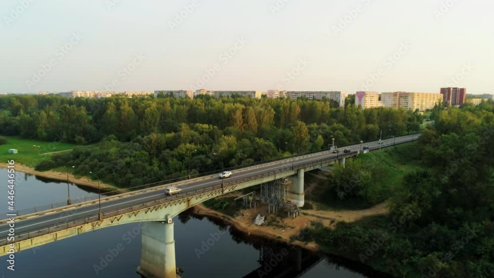 Aerial Shot of Novopolotsk, Belarus, Europe. Car Bridge across Western Dvina or Daugava River in Summer. 4K Pedestal Background Drone view Video Aerial Shot of Novopolotsk, Belarus, Europe. Car Bridge across Western Dvina or Daugava River in Summer. 4K Pedestal Background Drone view Video