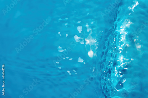 Water waves in sunlight with copy space. Abstract surface blue