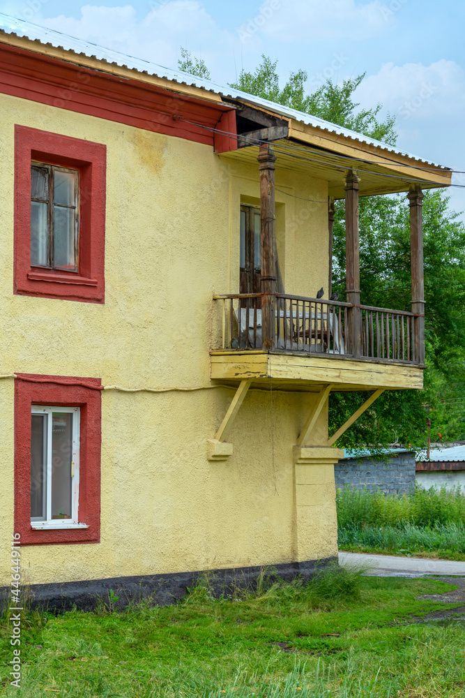 A fragment of the facade of an old house with an unusual balcony in Guryevsk A fragment of the facade of an old house with an unusual balcony in Guryevsk