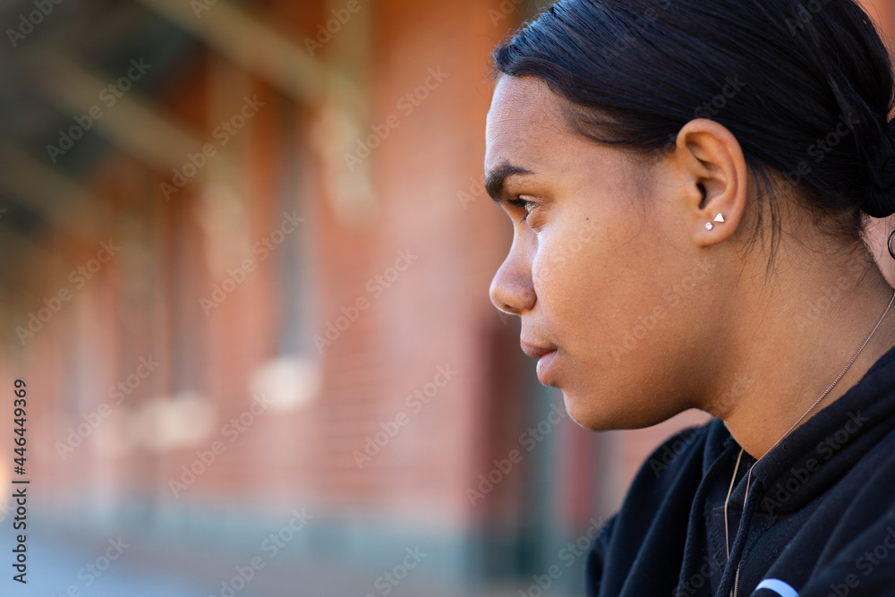 close up profile of teenage girl looking across frame with copy space close up profile of teenage girl looking across frame with copy space