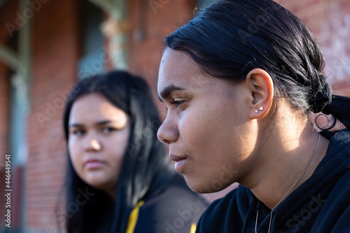 head and shoulders of two aboriginal girls with one in profile photo