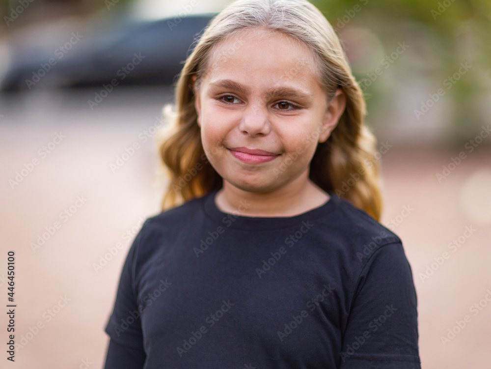 head and shoulders of ten year old aboriginal child with blonde hair head and shoulders of ten year old aboriginal child with blonde hair