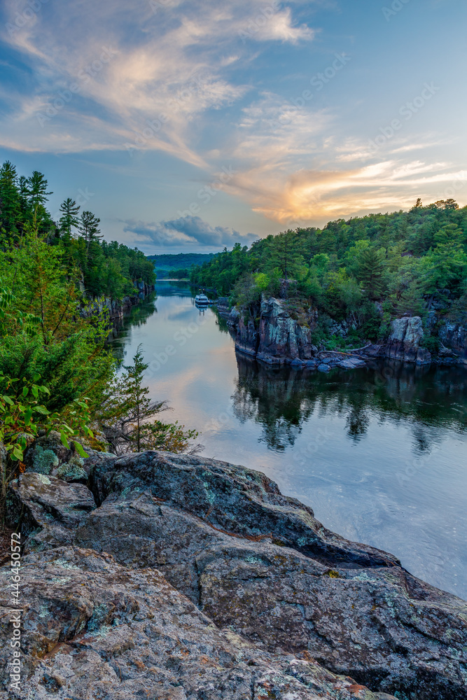 St. Croix River during sunset with colorful sky at Interstate State Park in St. Croix Falls Wisconsin. 
