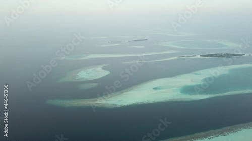 Aerial  Drone Tropical Island on the Maldives with white beaches and azure blue water photo