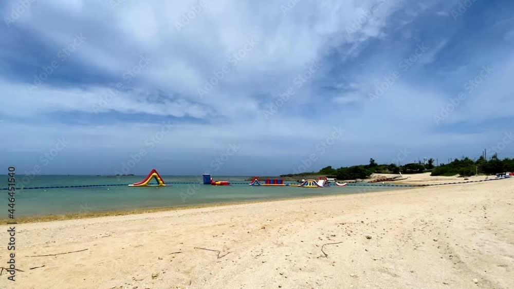 YOMITANSON, OKINAWA, JAPAN - JUNE 2021 : View of Zanpa beach (Ocean or sea). Wide view, time lapse shot in daytime. Holiday, vacation and resort concept shot. YOMITANSON, OKINAWA, JAPAN - JUNE 2021 : View of Zanpa beach (Ocean or sea). Wide view, time lapse shot in daytime. Holiday, vacation and resort concept shot.