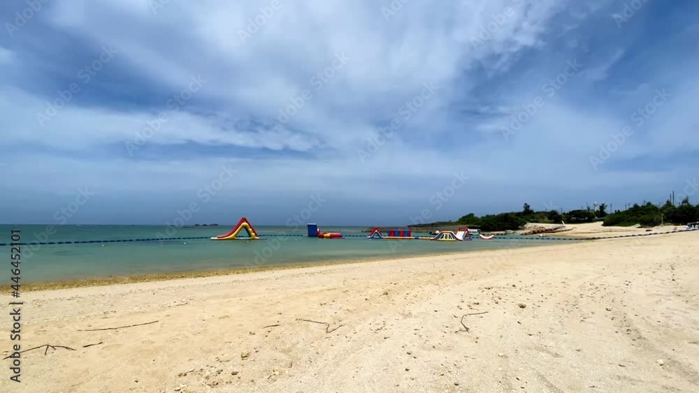YOMITANSON, OKINAWA, JAPAN - JUNE 2021 : View of Zanpa beach (Ocean or sea). Wide view, time lapse shot in daytime. Holiday, vacation and resort concept shot. YOMITANSON, OKINAWA, JAPAN - JUNE 2021 : View of Zanpa beach (Ocean or sea). Wide view, time lapse shot in daytime. Holiday, vacation and resort concept shot.