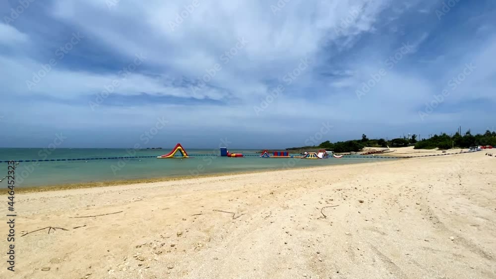 YOMITANSON, OKINAWA, JAPAN - JUNE 2021 : View of Zanpa beach (Ocean or sea). Wide view, time lapse shot in daytime. Holiday, vacation and resort concept shot. YOMITANSON, OKINAWA, JAPAN - JUNE 2021 : View of Zanpa beach (Ocean or sea). Wide view, time lapse shot in daytime. Holiday, vacation and resort concept shot.
