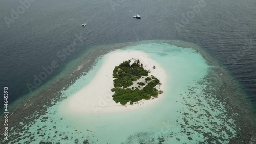 Aerial  Drone Tropical Island on the Maldives with white beaches and azure blue water photo