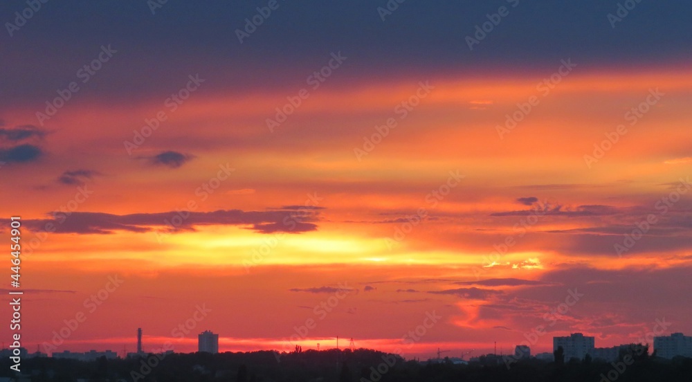 Beautiful red fiery sunset over the city, natural background 