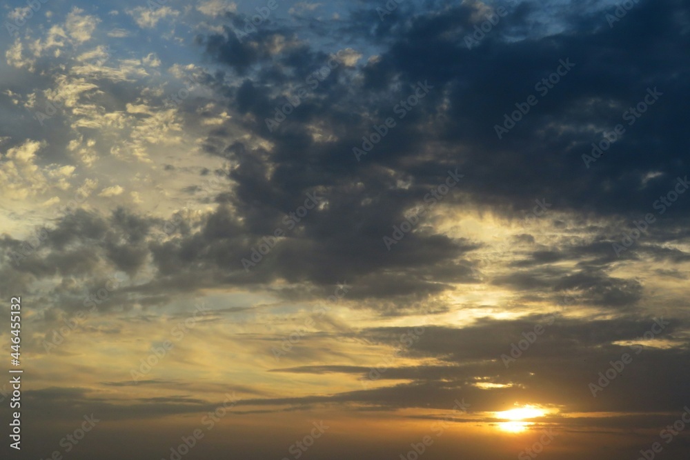 Dark dramatis clouds in the sky at sunset, natural background