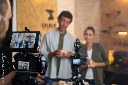 Two carpenters being filmed for the blog