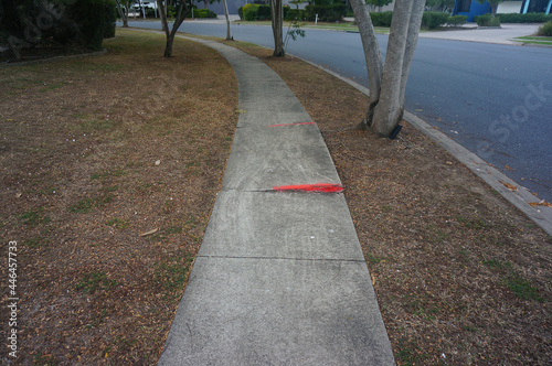 Fotografija To reduce the risk of trips and falls, the edge of the uneven tile on the walkway is colored red