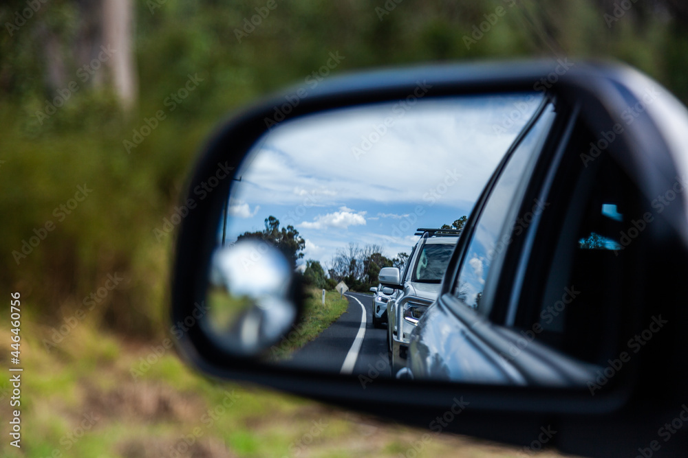 Backed up traffic in car side mirror Backed up traffic in car side mirror