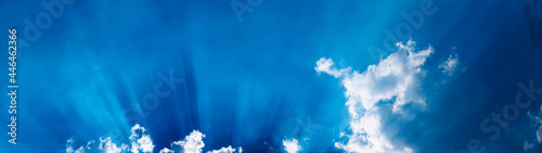 Sun rays on cloudy sky dramatic view banner panoramic