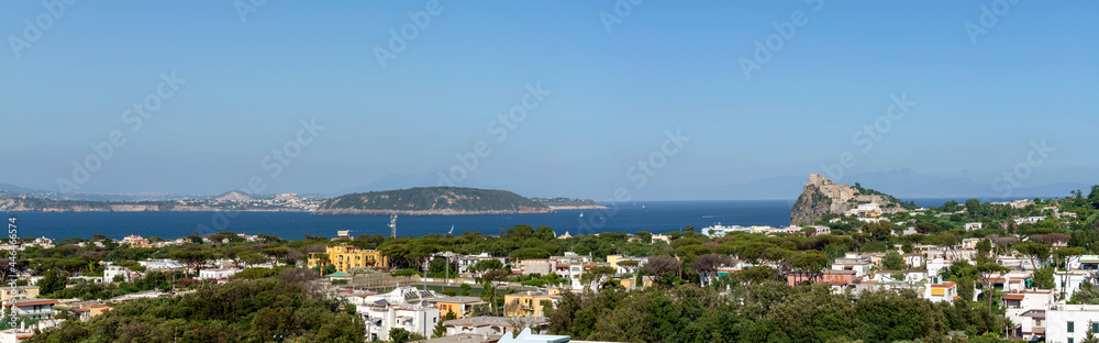 Panoramic view of the island of Ischia with the Aragonese castle to the right and the island of Procida in front, Gulf of Naples, Italy.