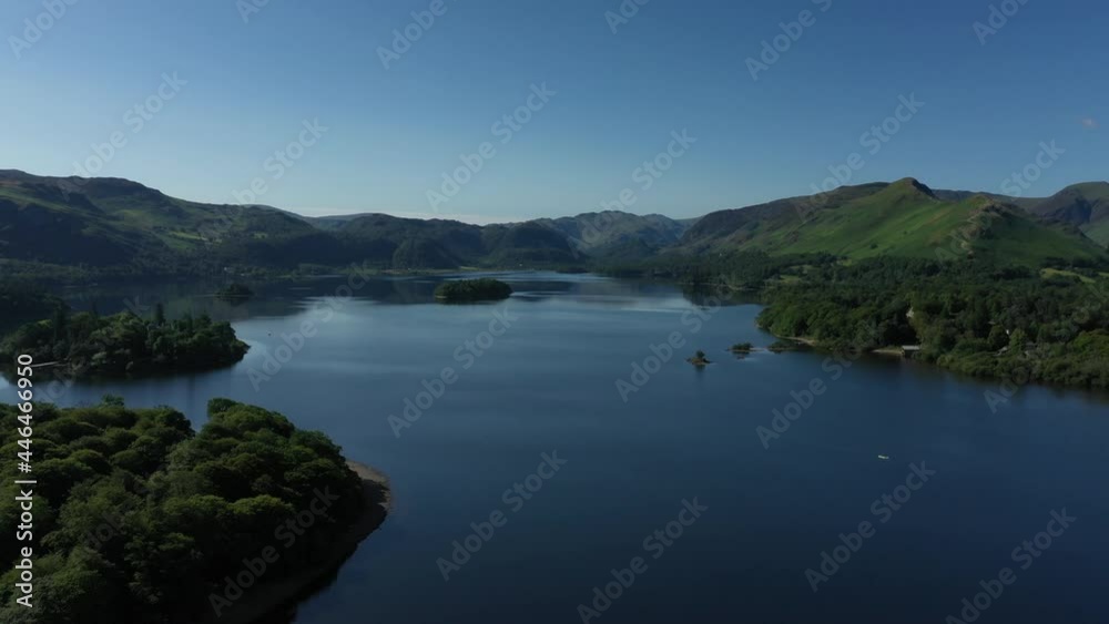 4K: Drone Aerial Clip of Derwentwater, Keswick in the English Lake District, Cumbria, UK. Approach shot in Summer with Blue Sky. Stock Video Clip Footage 4K: Drone Aerial Clip of Derwentwater, Keswick in the English Lake District, Cumbria, UK. Approach shot in Summer with Blue Sky. Stock Video Clip Footage