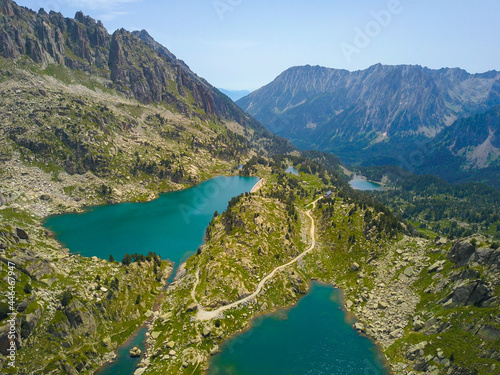 Aerial view of a wild lake in the middle of the high mountains of pyrenees.