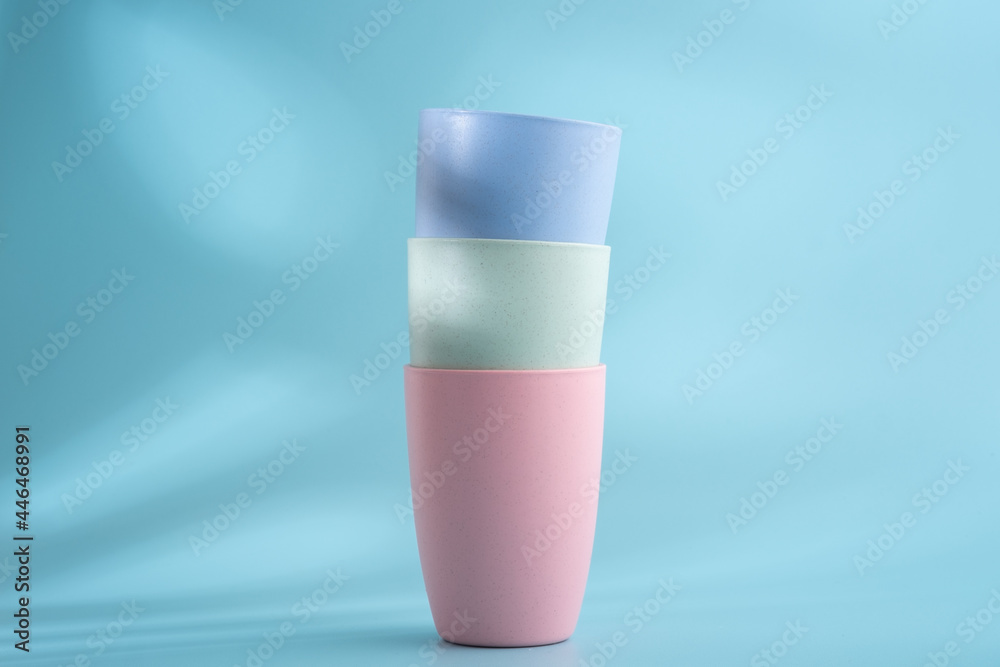 Colorful plastic cups on a white background Colorful plastic cups on a white background