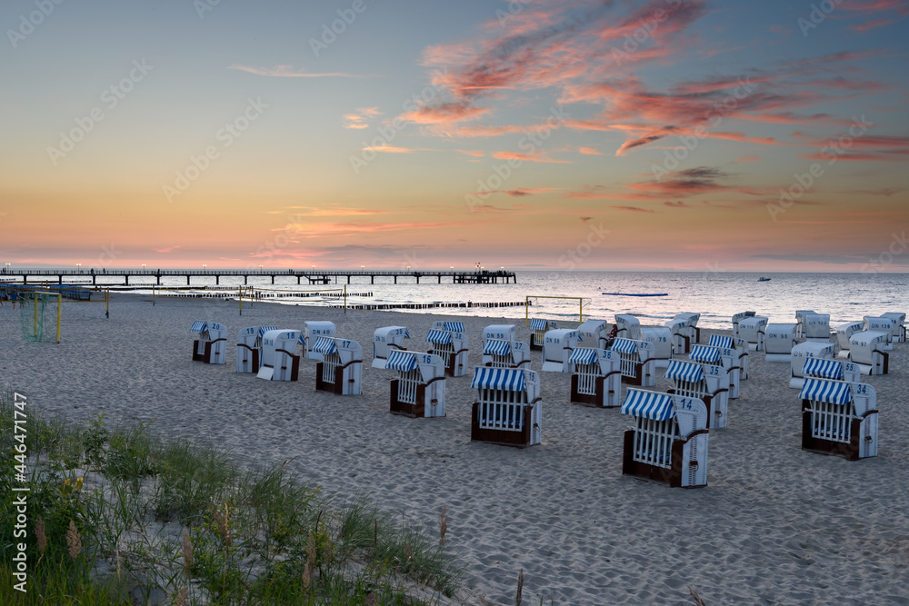 Kuehlungsborn, Germany, Baltic Sea coast: evening atmosphere and sunset at the beach and pier