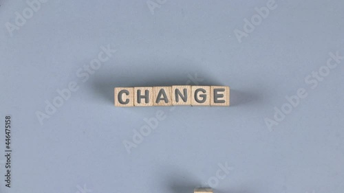 Wooden blocks with Chance sign going to Change. Concept of Success, Growth and Innovation. Gray background. High quality 4k video.