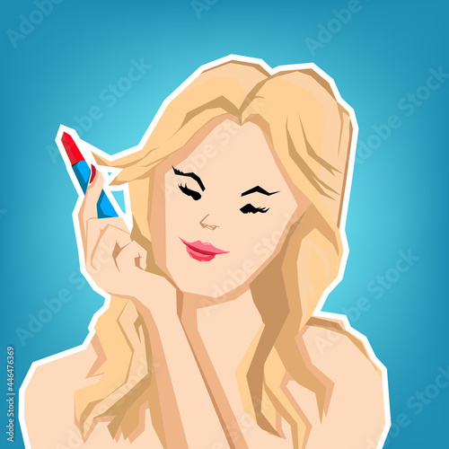 Beautiful woman applying lipstick to her mouth doing cosmetic makeup