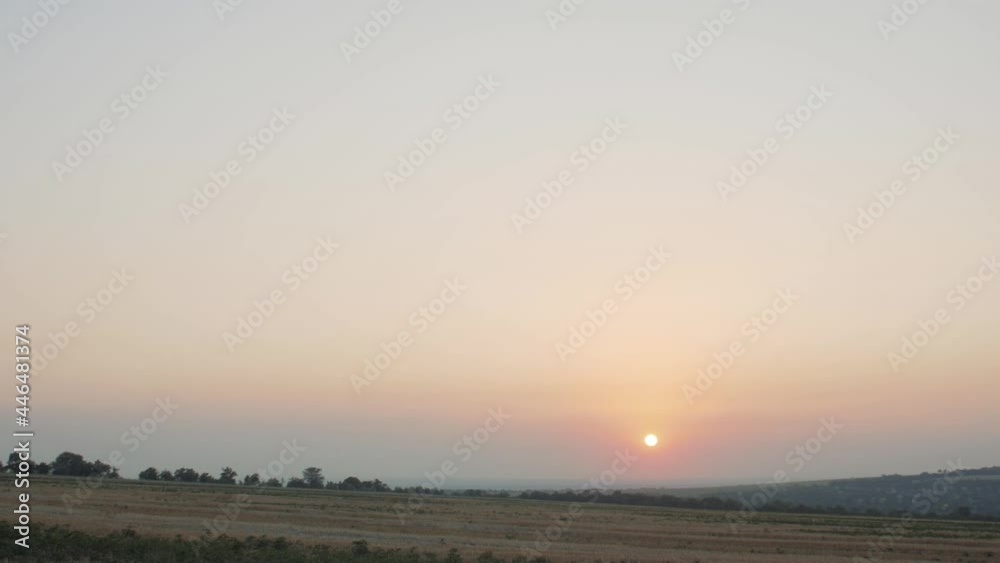 man in cheerful mood throwing paper airplane in field on sunset on background of clear sky, concept of active rest outdoors and relaxation, toy of childhood man in cheerful mood throwing paper airplane in field on sunset on background of clear sky, concept of active rest outdoors and relaxation, toy of childhood