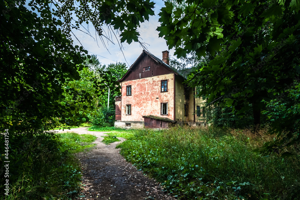 Old run down house with crumbling facade, still inhabited by residents