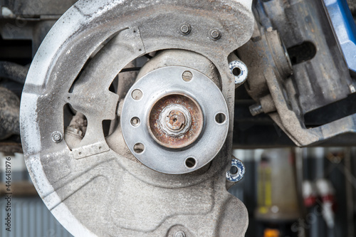 Maintenance of SUV vehicles. The process of replacing the brake disc at the stage of cleaning the hub. Part of a series.