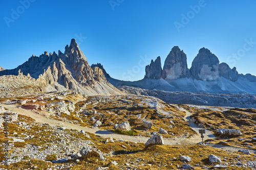 Tre Cime di Lavaredo, sunset scene, illuminated by red light, Italy