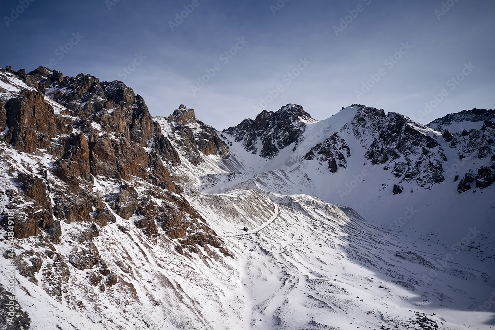 Obraz premium Snow Rocky Mountains with Blue Sky in Kazakhstan 